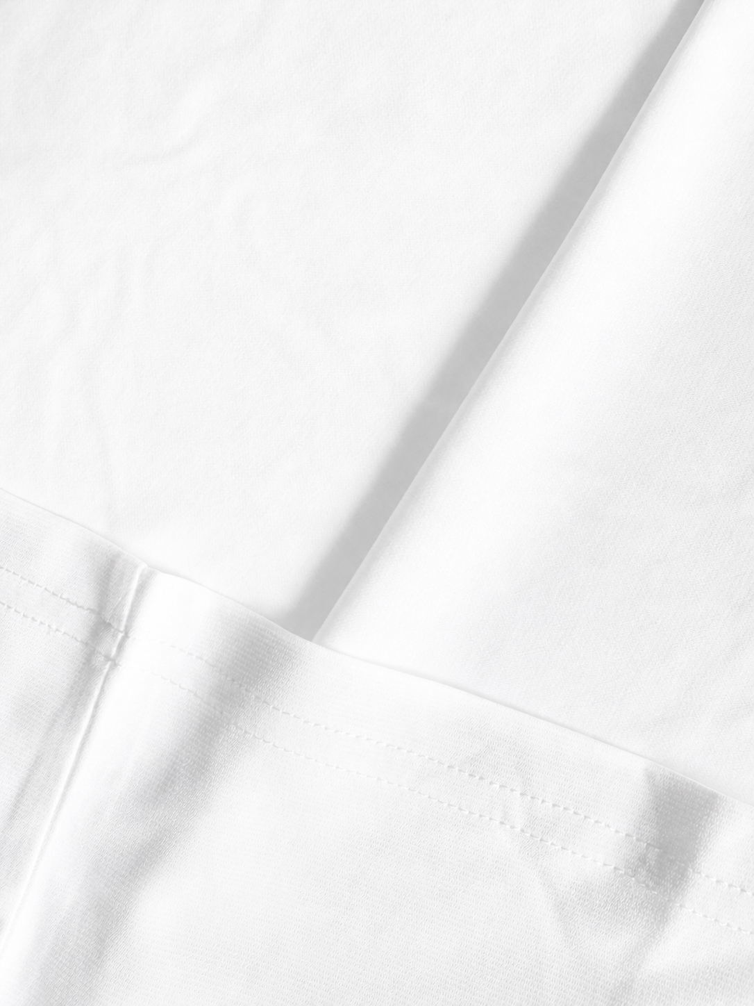 White Edition fabric and seam detail — studio background
