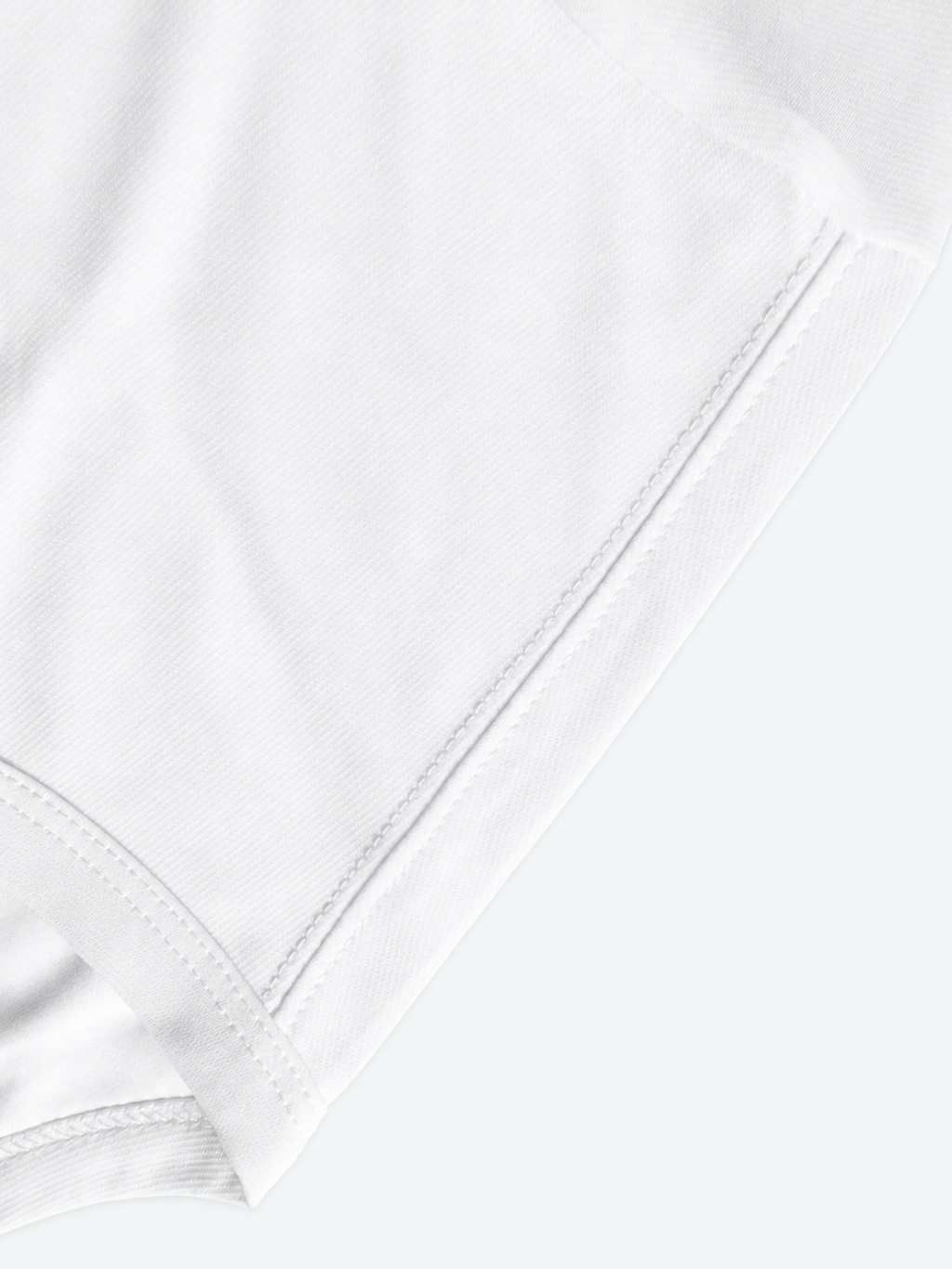 White Edition hem and double-stitch detail — studio background