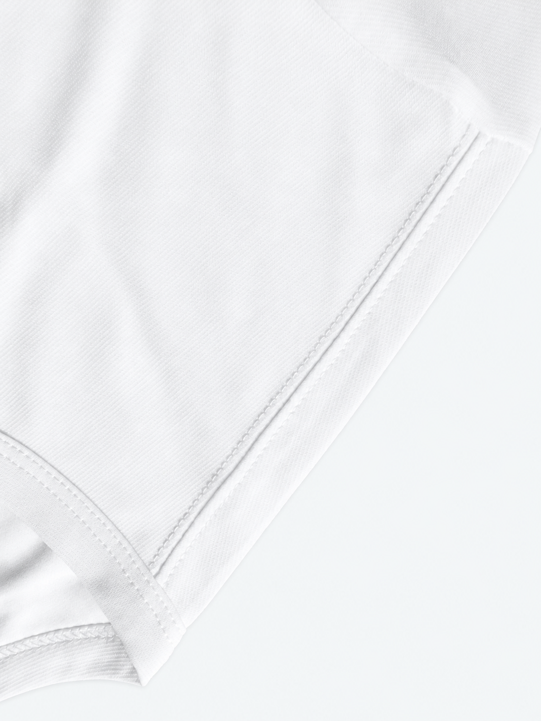 White Edition hem and double-stitch detail — studio background